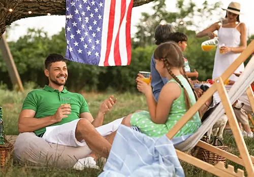 Happy family at picnic on labor day
