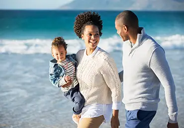 Happy family having fun on beach