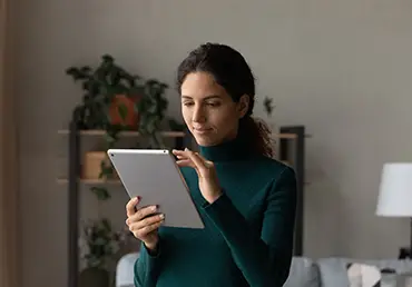 Latin woman browsing online on a tablet
