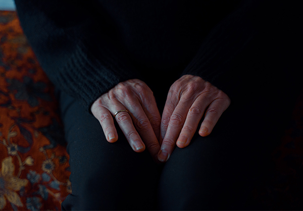 Hands of a person dealing with death.