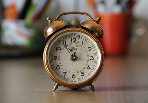 An old-fashioned alarm clock is photographed.