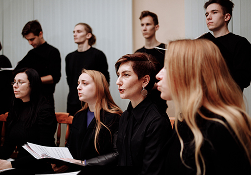A choir sings together. Does singing improve their health?