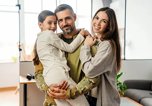Happy family in their home, how much life insurance?