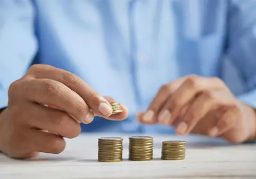 Stack of coins representing steady and guaranteed financial growth over time with a fixed annuity.