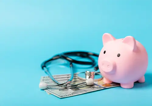 piggy bank and medical tool representing whether life insurance is a good investment for people